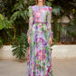Carla Ruiz 50405: Spring-Inspired Floral Print Gown with Sheer Sleeves and Cinched Waist