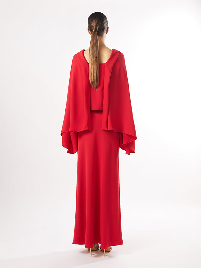 Back view of the ensemble showing the elegant drape of the blouse and the smooth line of the skirt, in the available colors of red, maroon, and fuchsia.