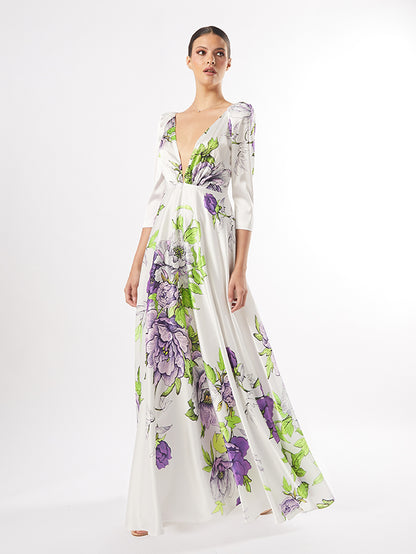 Model in an Elegant Floral Maxi Dress with a V-Neck and Long Sleeves, showcasing vibrant multipink and multigreen floral patterns on a flowy fabric.